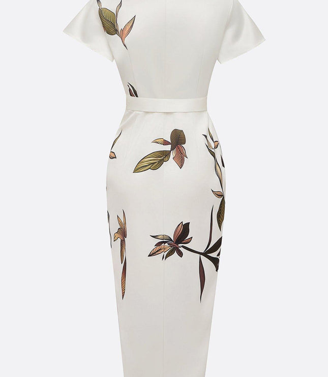 Back view of the white leaf print v-neck short sleeve midi wrap dress, highlighting the leaf pattern and waistline.
