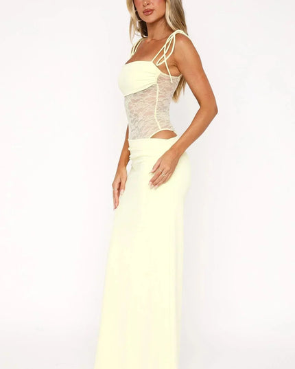Side view of a pale yellow women's maxi dress featuring a lace panel bodice, spaghetti straps, and a square neckline.