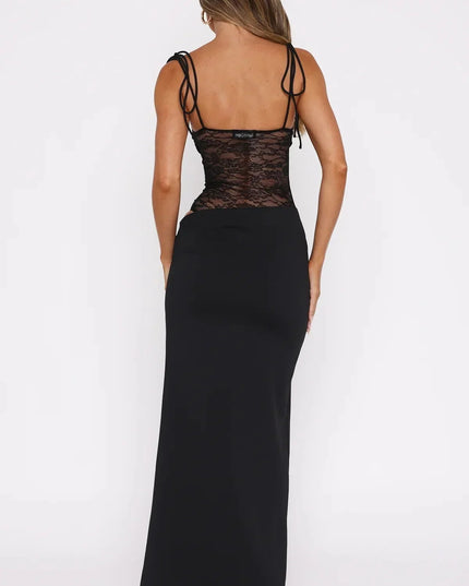 Back view of a black women's lace panel maxi dress with spaghetti straps and a square neckline, showcasing the full length.