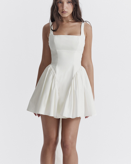 Close-up front view of the white square neck mini dress, emphasizing the structured bodice and flared skirt.