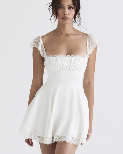 Full-length front view of a white mini dress with delicate lace cap sleeves and a square neckline, showcasing the fitted bodice and flowing skirt.