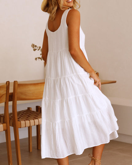 Back view of the white square neck sleeveless tiered midi dress, showcasing the simple back design and tiered skirt.