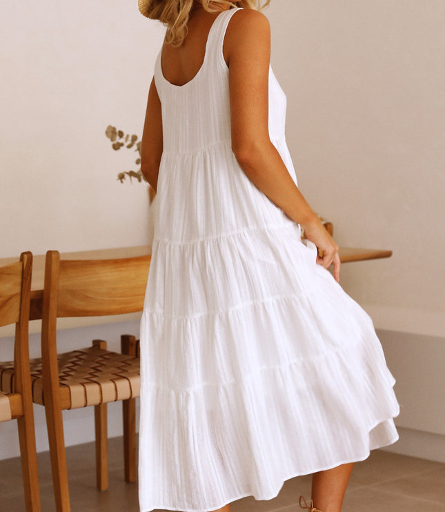 Back view of the white square neck sleeveless tiered midi dress, showcasing the simple back design and tiered skirt.