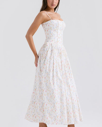 Side view of women's white floral print square neck midi dress, highlighting the fitted bodice and flowing skirt, with pink heels.