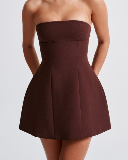Three-quarter shot of the dark brown strapless mini dress, showcasing its versatile style.