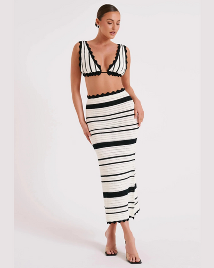 Women's summer striped crochet two piece maxi set featuring a black and white striped crop top and matching maxi skirt with scalloped edges.