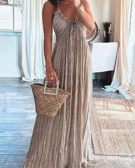 Full-body shot of the women's summer backless striped maxi dress in a neutral tone, with a U-neckline.