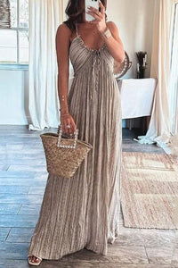 Full-length view of a women's summer backless striped maxi dress in beige with U-neck and tie detail.