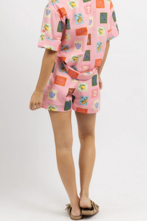 Back view of women's pink printed short sleeve short set, showing the full design and matching belt.