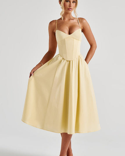 Full view of the light yellow sweetheart corset midi dress with a flowing skirt, for summer occasions.