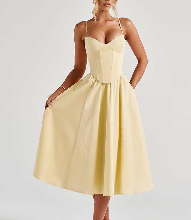 Full view of the light yellow sweetheart corset midi dress with a flowing skirt, for summer occasions.