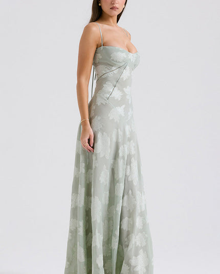 Full body side view of women's sage green floral printed sweetheart neck maxi dress with thin straps.