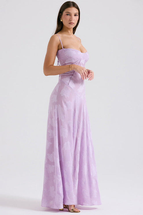 Side profile of the women's lavender floral maxi dress, highlighting the fitted bodice and long, elegant silhouette.
