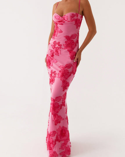 Full body view of women's pink floral sweetheart neck maxi dress, hands on hips, showcasing the elegant silhouette.