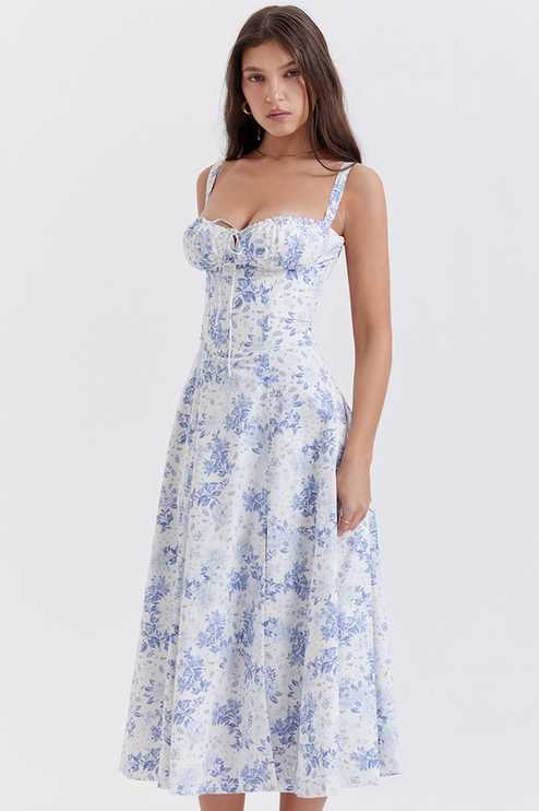 Side profile of women's white floral midi dress featuring a corset-style bodice and blue flower pattern