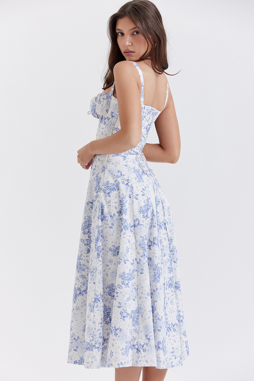 Back view of women's white summer midi dress with blue floral print, showcasing the flowy skirt