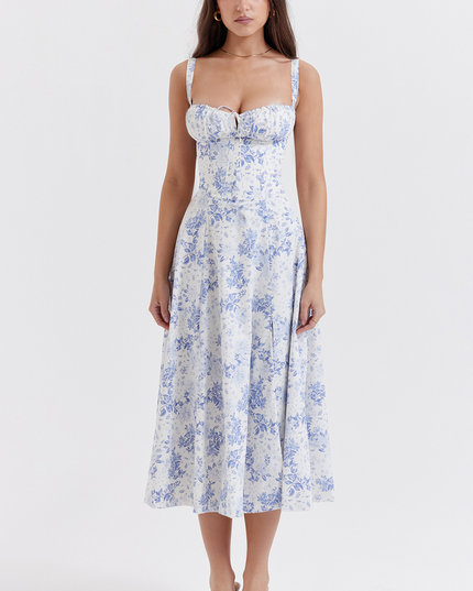 Full body shot of women's white midi dress with blue floral pattern, for summer occasions