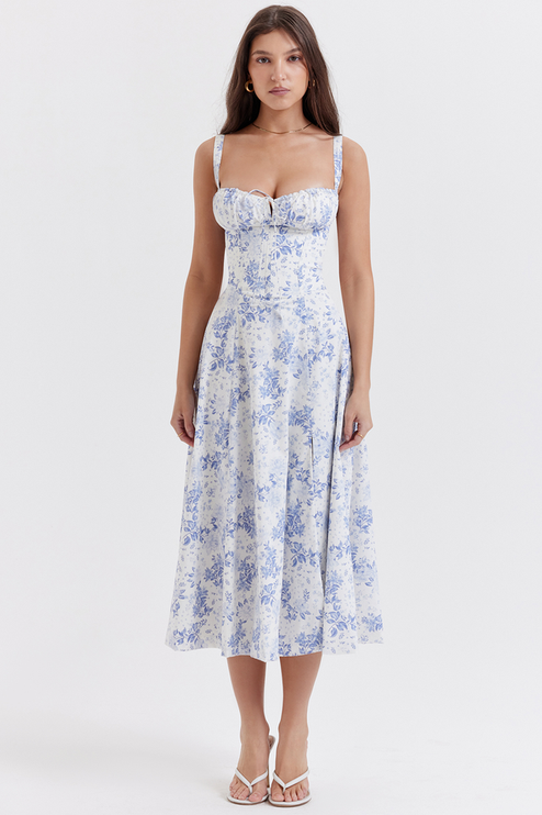 Full-length view of a women's white summer midi dress with blue floral print and sweetheart neckline