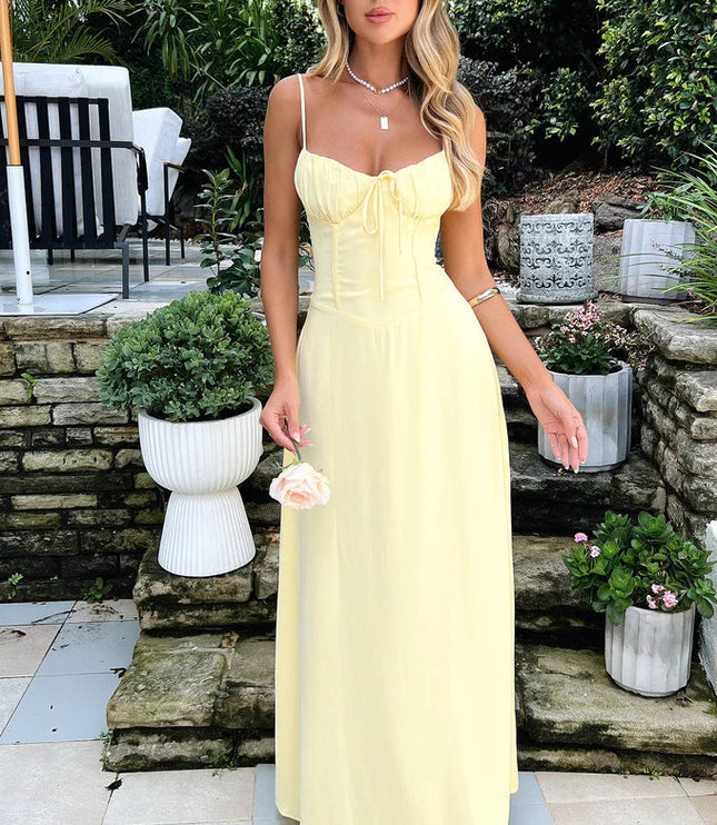 Front view of a women's pale yellow maxi dress with a tie-front sweetheart neckline and a defined, corset bodice.