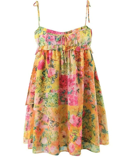 Flat lay of the yellow floral print tie shoulder mini dress, showing the tiered ruffles and vibrant pattern.