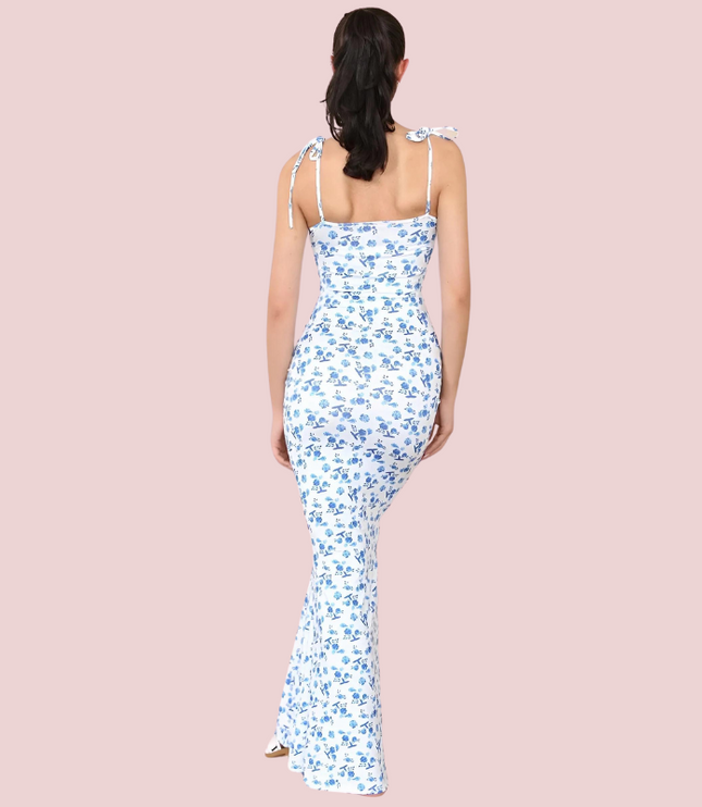 Back view of women's floral tie-strap sleeveless maxi dress, showing fitted silhouette