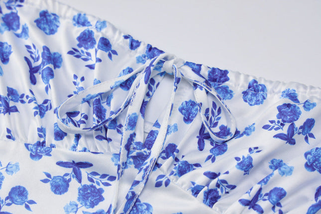 Close-up of the bust detail on the floral maxi dress, showing tie straps and ruched neckline