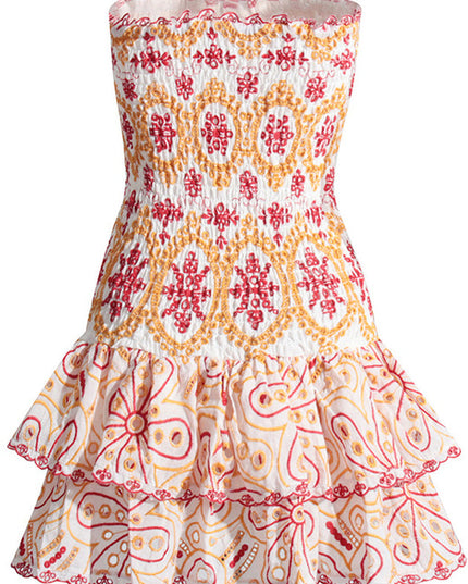 Flat lay front view of a white strapless mini dress with red and orange embroidery, showcasing the shirred top and tiered ruffles.