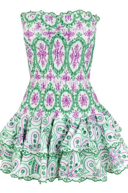 Flat lay front view of a white strapless mini dress with intricate green and purple embroidered patterns and tiered ruffles.