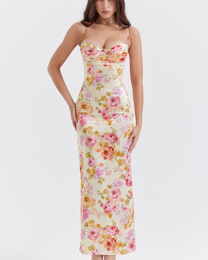 Full length view of a women's floral maxi dress with sweetheart neckline and delicate lace trim, hands on hips.