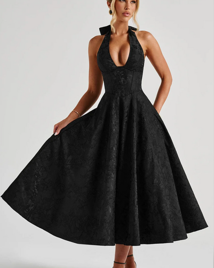 Elegant black jacquard midi dress featuring a halter v-neckline and a flowing A-line skirt, ideal for prom or evening wear.