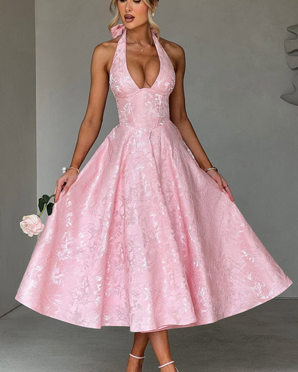Pink jacquard halter v-neck midi dress with a full skirt and structured bodice, for prom.