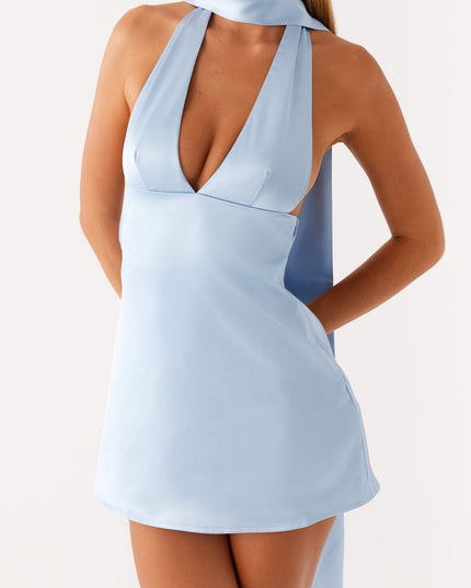 Front detail of the light blue satin halter mini dress, emphasizing the V-neck and side cutouts.