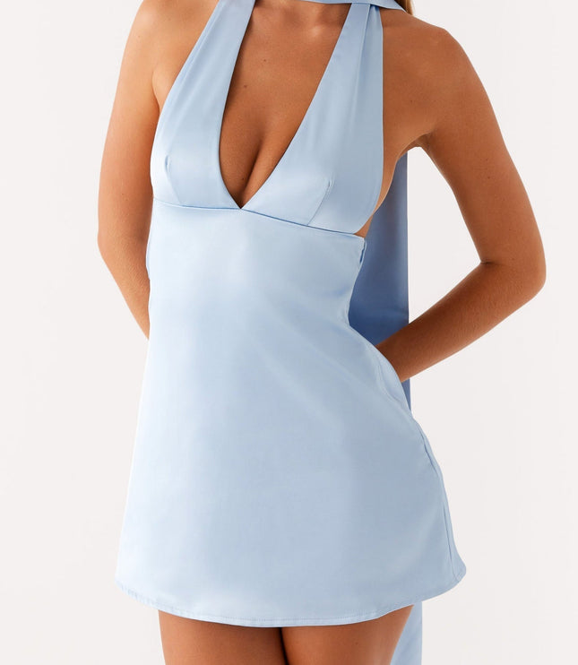 Front detail of the light blue satin halter mini dress, emphasizing the V-neck and side cutouts.