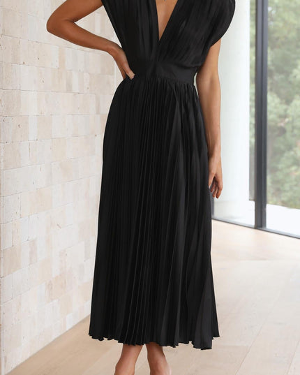 Full-body shot of the women's black pleated v-neck midi dress, featuring a cinched waist and elegant flowing skirt.