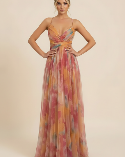 Front view of a women's printed V-neck sleeveless maxi dress, ideal for wedding guests, with hands on hips.