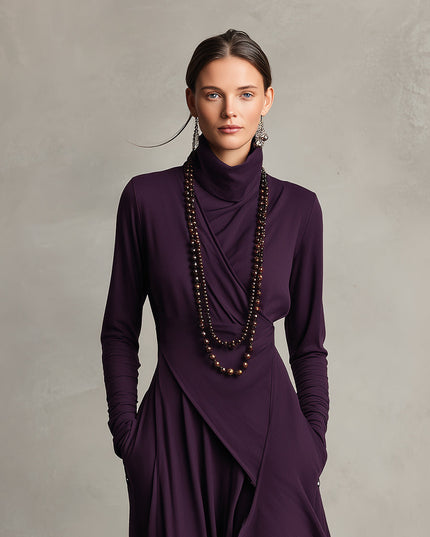 Close-up of the high neck and draped bodice details on the plum long sleeve midi dress with pockets.