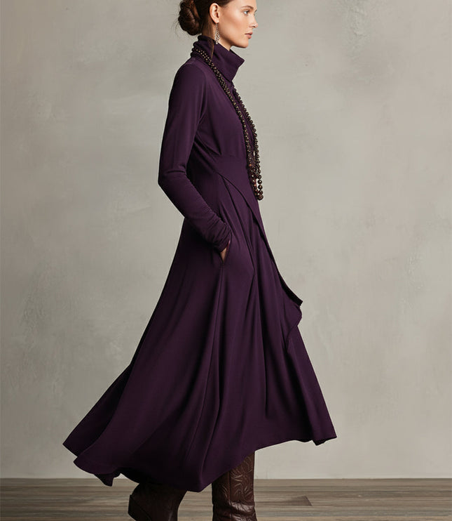 Side profile of the plum long sleeve midi dress, showing the movement and layered drape of the skirt.
