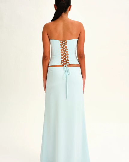 Light blue strapless corset maxi dress back view with lace-up corset detail and long skirt