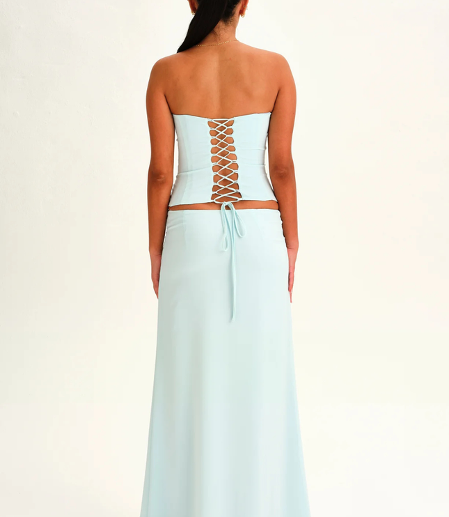 Light blue strapless corset maxi dress back view with lace-up corset detail and long skirt